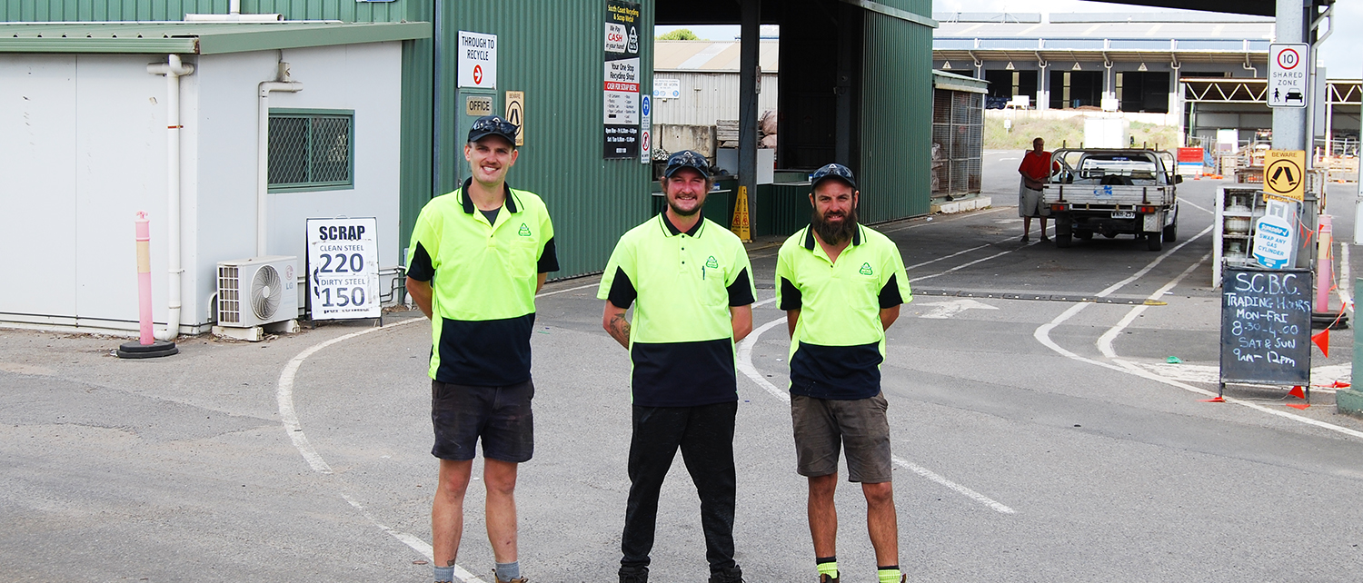 Goolwa South Coast Recycling & Scrap Metal Co staff standing in front of recycling depot.